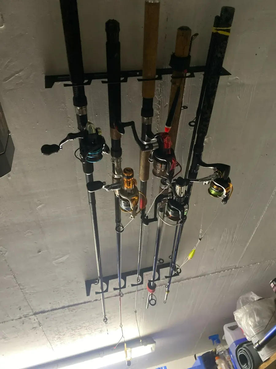 Fishing rods stored on a wall-mounted rack